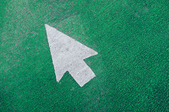 Arrow symbol on urban street and bike lane