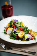 Gourmet spanish salad with artichokes and greens