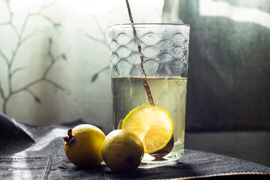A glass of delicious lemon tea with guavas