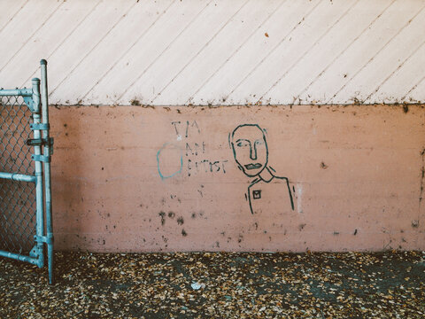 crude graffiti on school wall