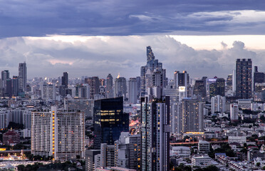 Fototapeta premium Bangkok, Thailand - Sep 24, 2020 : Bangkok downtown cityscape with skyscrapers at evening give the city a modern style. No focus, specifically.