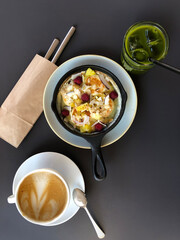 Pan top view dessert coffee latte cappuccino cup berries cheesecake pancake dutch matcha