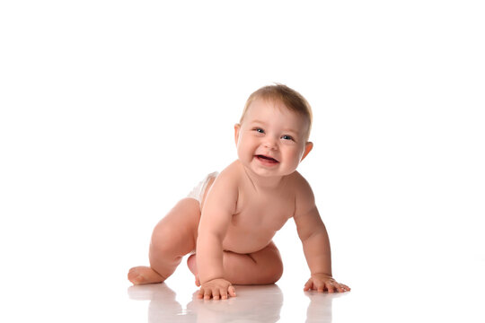 cute toddler baby in diapers smiling happily on white background