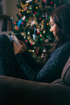 Pajamas: Pretty Woman Using Cel Phone By Christmas Tree