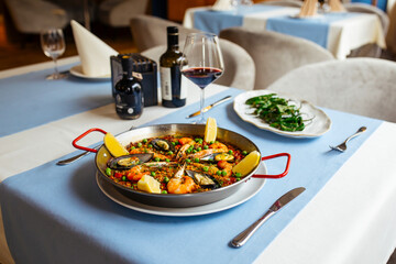 Spanish dishes seafood paella and padron peppers