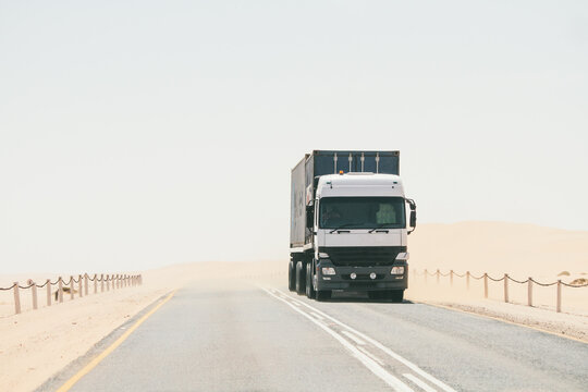 Cargo truck driving on a desert road