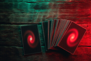 Tarot cards deck on the old table background.