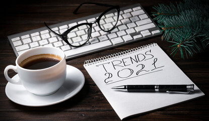 cup coffee and Notebook with Notepad on the table.