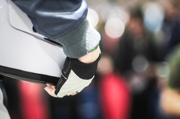 Racers hold helmets In the award ceremony. Selective focus.