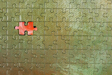 Disassembled puzzle with a last wrong piece impossible to fill