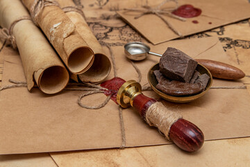 The old letter is sealed with sealing wax and a seal in an envelope. Scrolls with a wax seal.