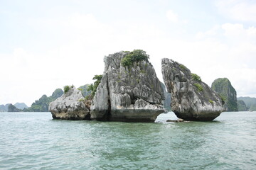Tourist junks floating among limestone rocks at early morning in Ha Long Bay, South China Sea, Vietnam, Southeast Asia. Five images panorama