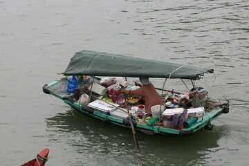 Obraz premium Tourist junks floating among limestone rocks at early morning in Ha Long Bay, South China Sea, Vietnam, Southeast Asia. Five images panorama