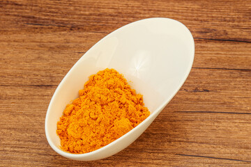 Tumeric powder in the bowl