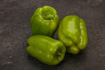 Three green bell juicy peppers