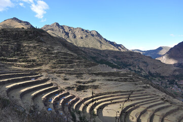 Dramatic landscape view of mountains, terraces and stone ruins in the Sacred Valley of Peru