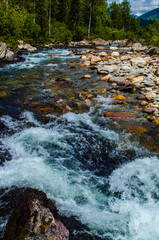 in summer rocky mountain river water silk. mountain river