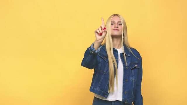 Young caucasian blonde woman showing number one with finger