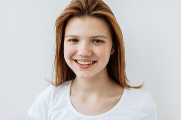 Fototapeta premium Happy Teen girl posing against white background