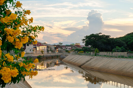 Canal in the city with sunset background.