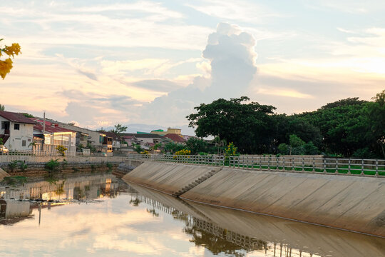 Canal in the city with sunset background.