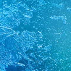 Macro view abstract winter ornament frosted window decorative textured pattern. Frozen ice flowers...
