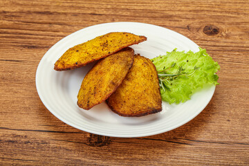 Baked potato with herbs and spices