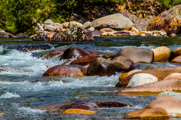 Fototapeta na wymiar in summer rocky mountain river water silk. mountain river