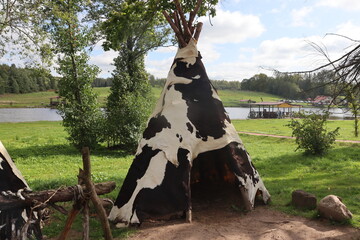 indians wigwam hut in forest view © Mikalai Drazdou
