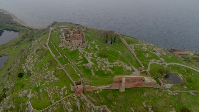 Aerial footage of the medieval castle ruin of Hammershus in Denmark, drone stock footage by DroneRune 4