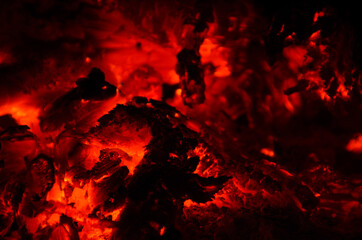 embers burn down in a hardwood fire - 380400229
