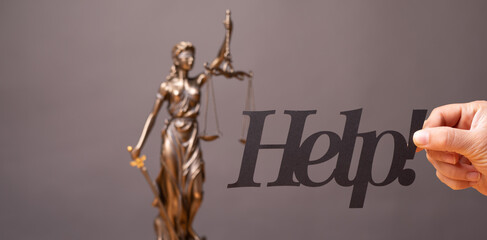 Legal and law concept statue of Lady Justice with scales of justice.