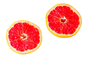 ripe, juicy red grapefruit cut in half, isolated on white background