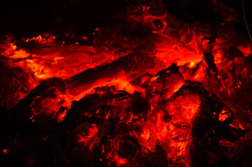 embers burn down in a hardwood fire - 380401251