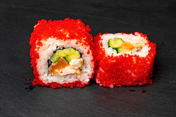 sushi on a black plate