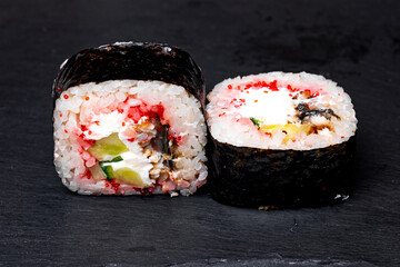sushi rolls on a black background