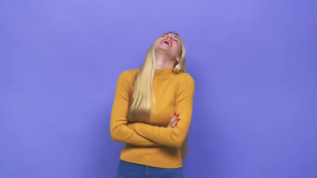 Young caucasian blonde woman laughing and having fun