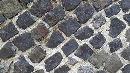 Wall of granite stones. Masonry. Vintage granite background