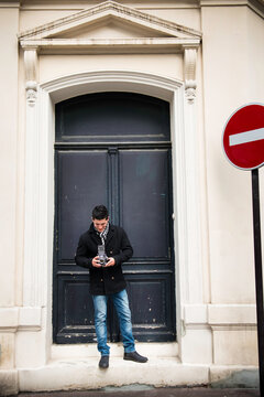 Parisian Looking Stylish Young Man With Vintage Camera in Paris France