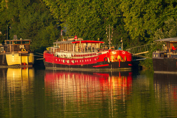 Avignon, France - 6/5/2015:  A canal boat on the Rhone River in Avignon.  Canal boat cruising in...