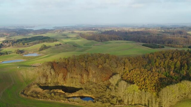 Flying over beautiful, colourful autumn countryside, drone stock footage 4