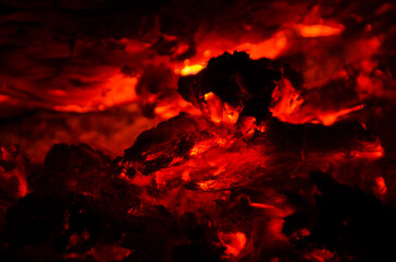 embers burn down in a hardwood fire - 380404081