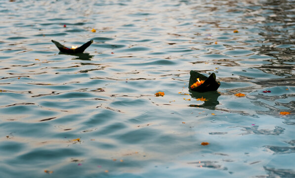 Burning Offering on the Water of the Ganges River in Varanasi, India.