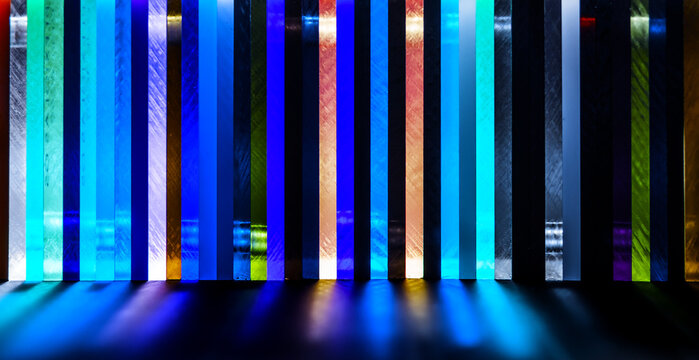 light through Stack of different colours Cast Acrylic Sheet on black background