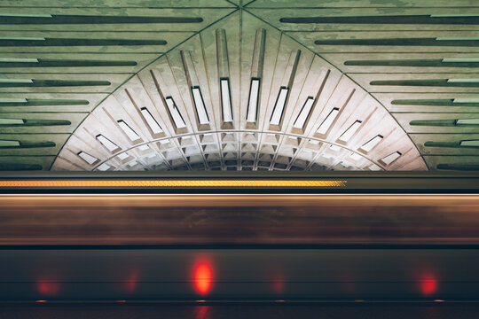 Metro train car moving through station, long exposure