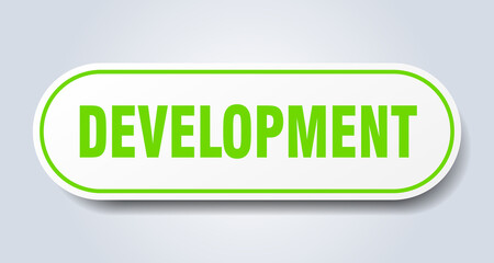 development sign. rounded isolated button. white sticker
