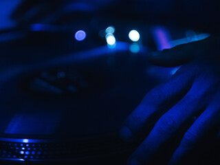 hand manipulating dj record