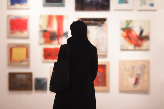 girl the gallery in front of the artwork