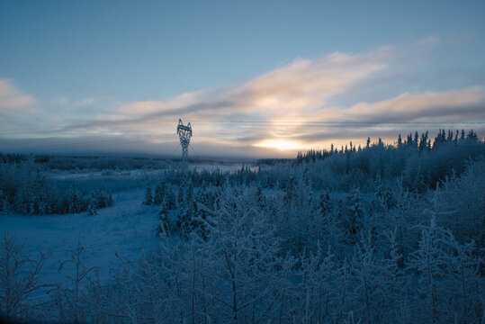 frost covered power lines in a wintery Alaska landscape