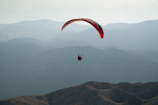 Parachutists Are Paragliding In Tahtali-Olympos Mountains. Antalya Turkey